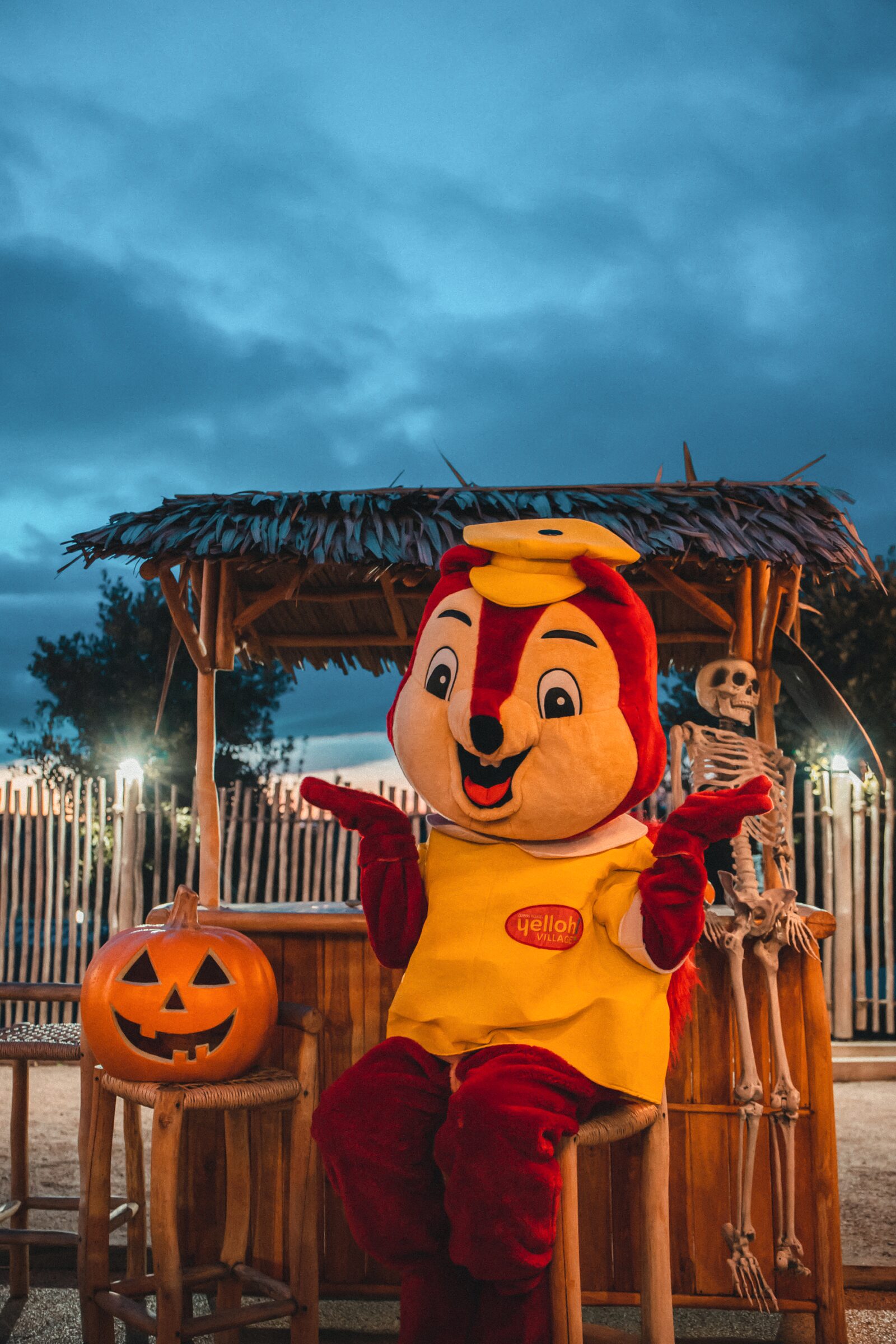 The campsite mascot in Halloween costume at nightfall