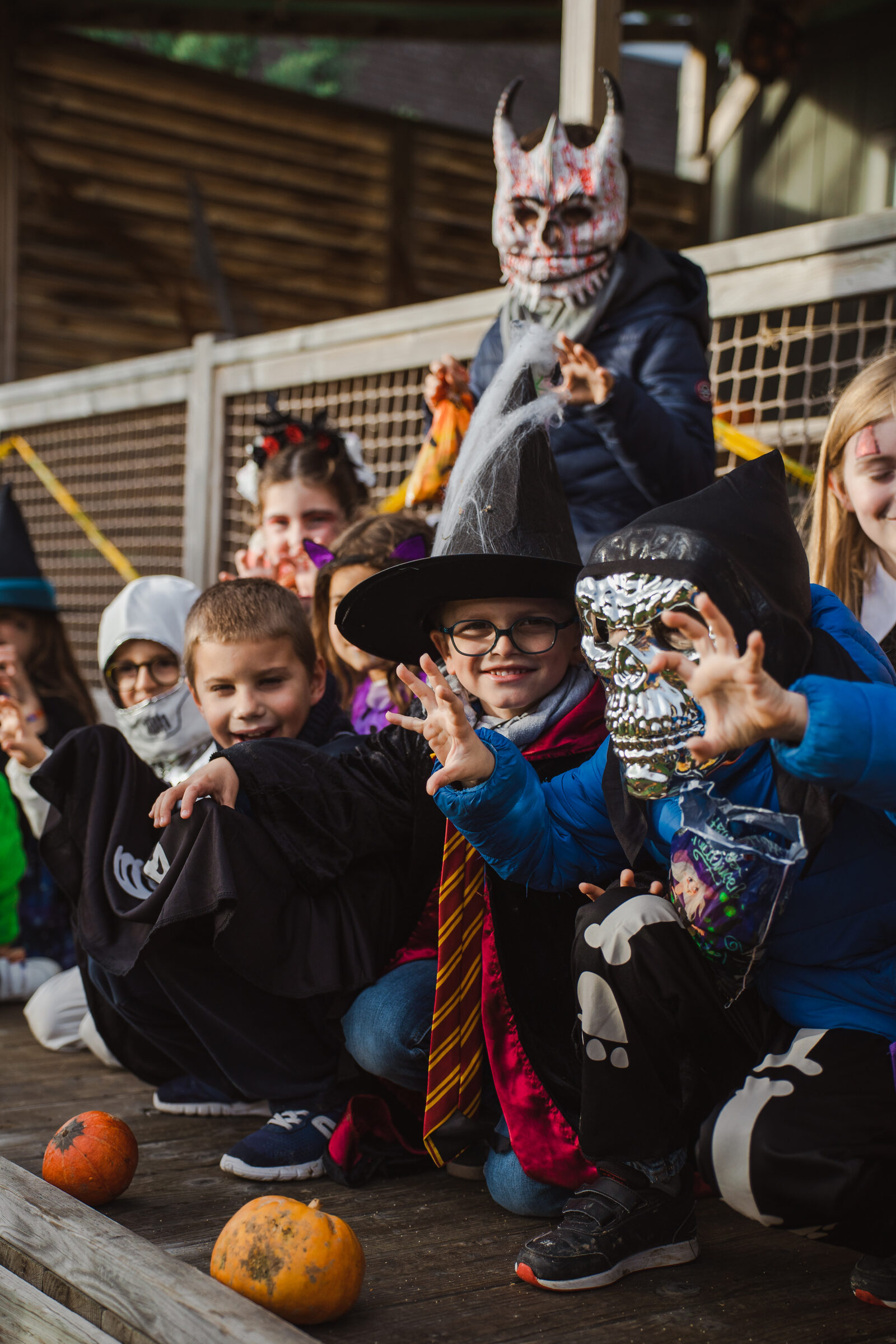 A group of children in Halloween costumes along the campsite paths